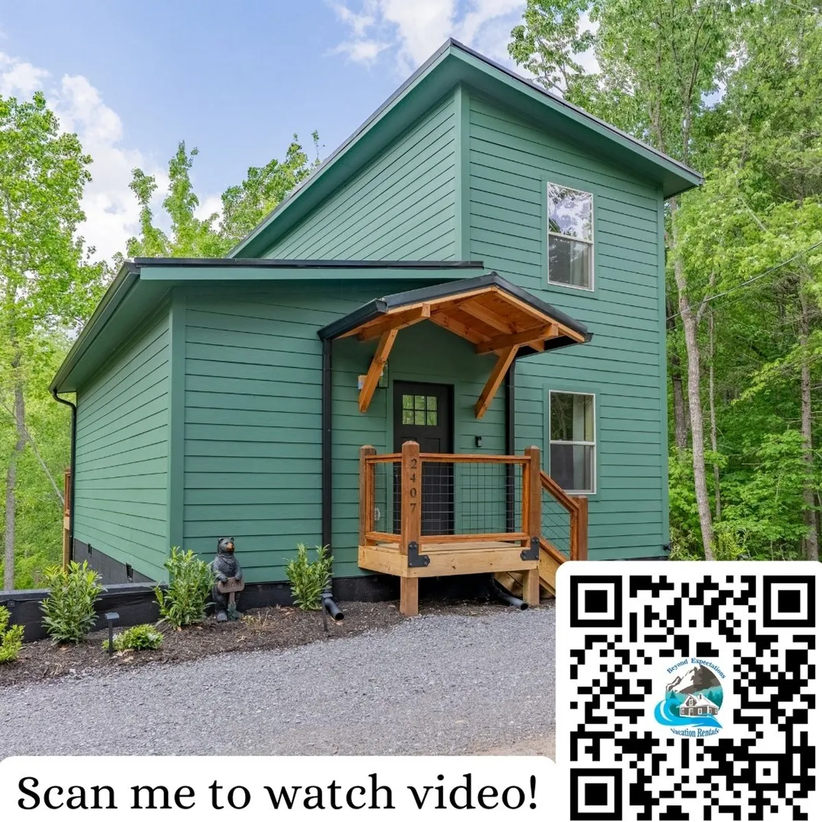 This image showcases the green exterior of the house with a welcoming wooden porch, set amidst lush greenery. The peaceful outdoor space invites families to relax, enjoy nature walks, or gather around the fire pit for evening activities.